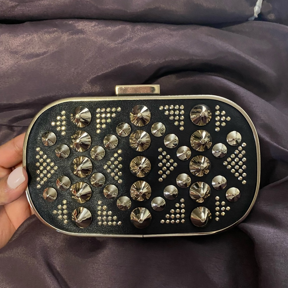 Gold studded satin clutch